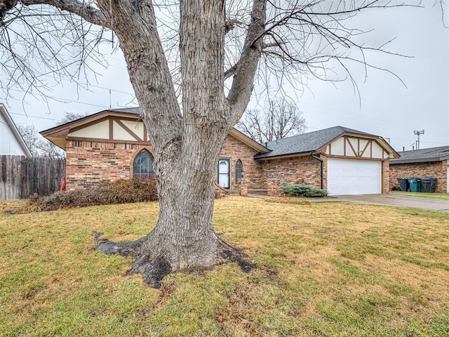 view of front of property with a garage and a front yard