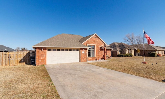 view of front of house featuring a garage and a front yard