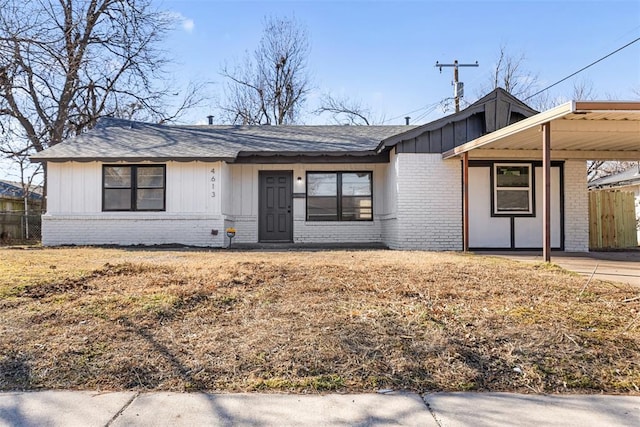 ranch-style house featuring a carport