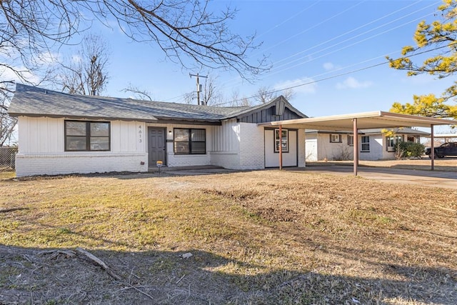 single story home with a carport and a front yard