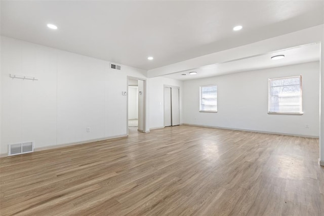 spare room with light hardwood / wood-style flooring