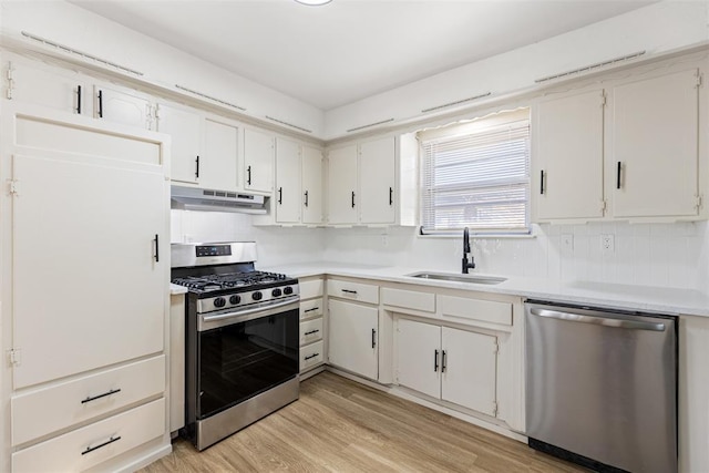 kitchen featuring white cabinetry, appliances with stainless steel finishes, and sink