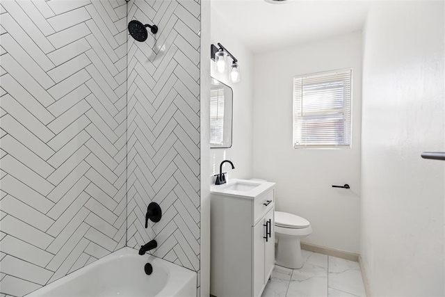 full bathroom featuring vanity, tiled shower / bath, and toilet