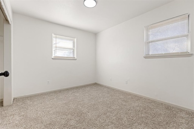 spare room featuring carpet