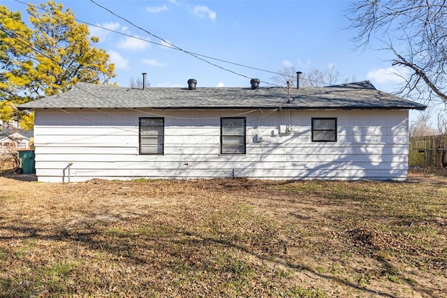 view of side of home with a lawn