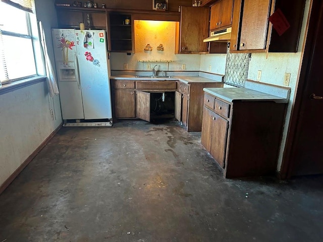 kitchen with white refrigerator with ice dispenser and sink