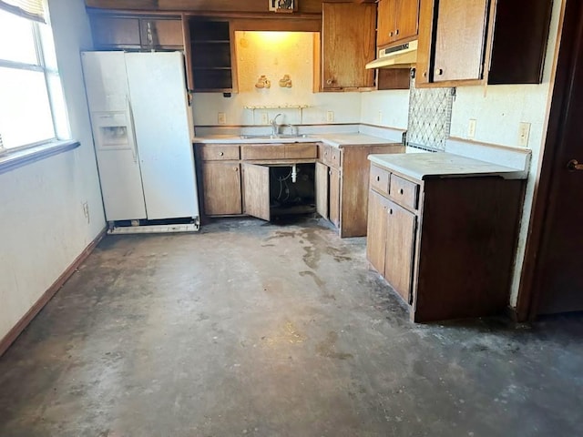 kitchen with white fridge with ice dispenser and sink