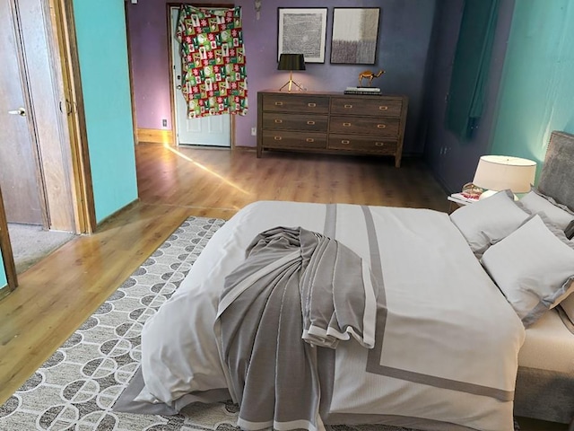 bedroom featuring wood-type flooring