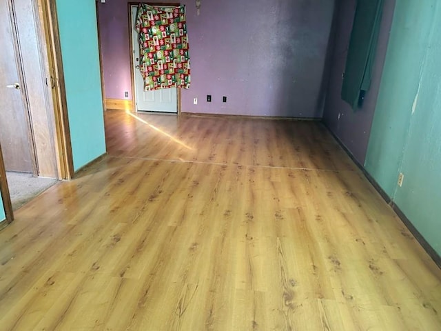 spare room with light wood-type flooring