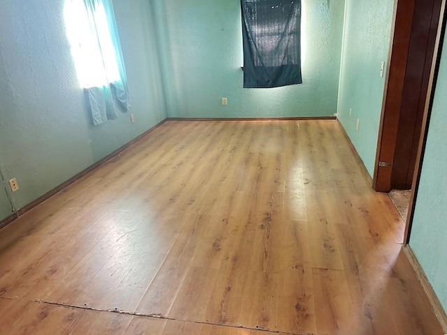 unfurnished room featuring light wood-type flooring