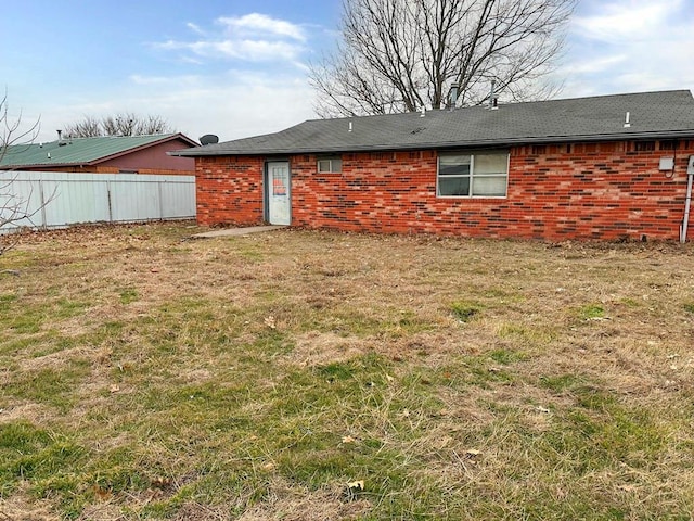 back of house with a yard