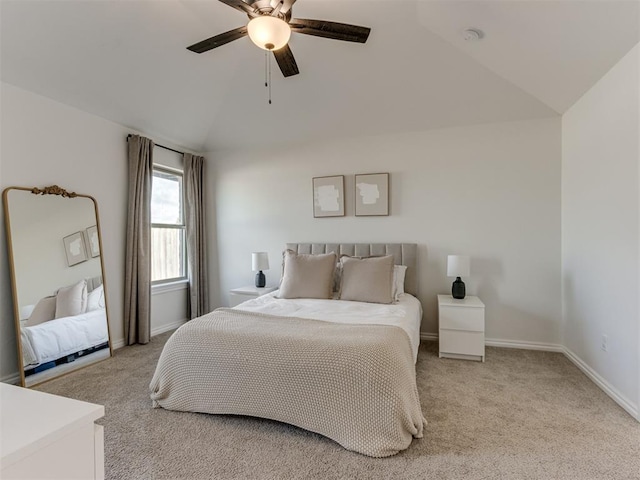 carpeted bedroom featuring vaulted ceiling and ceiling fan