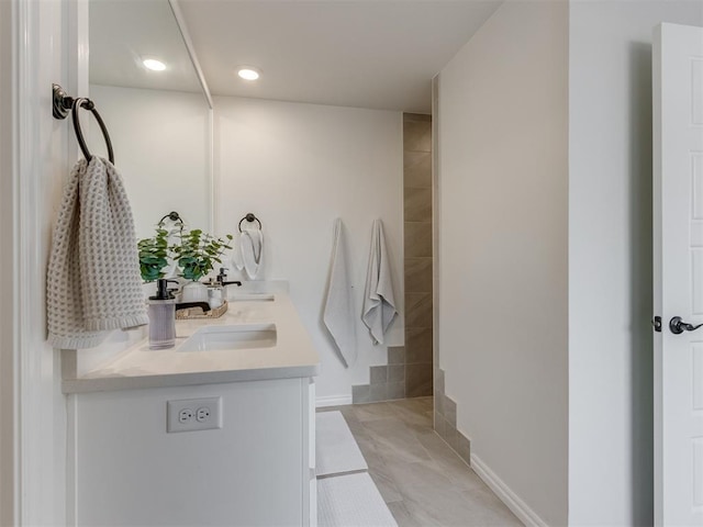 bathroom with tile patterned flooring and vanity