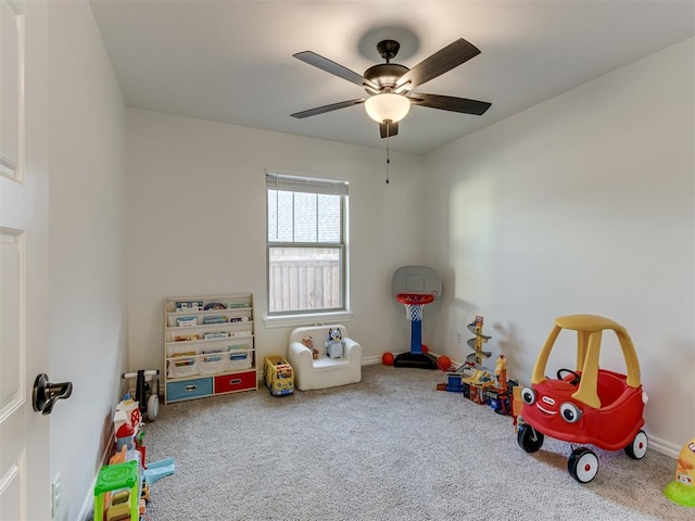 game room with carpet floors and ceiling fan