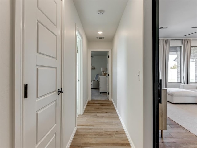 hallway featuring light hardwood / wood-style floors