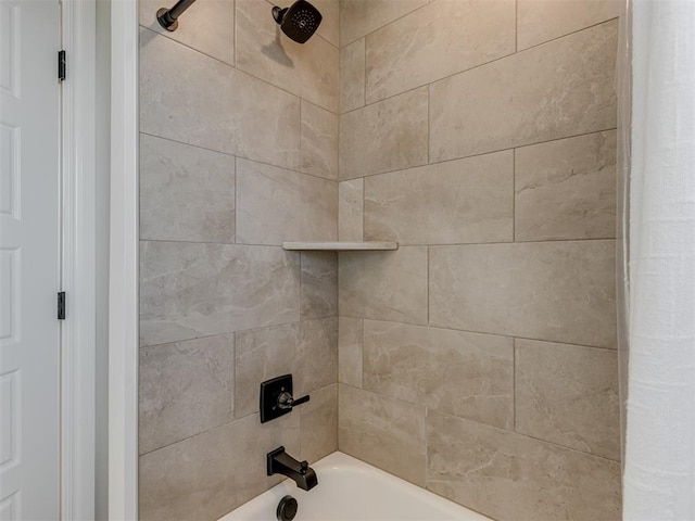 interior details featuring shower / bath combo