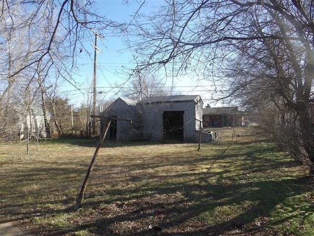 view of outbuilding featuring a lawn