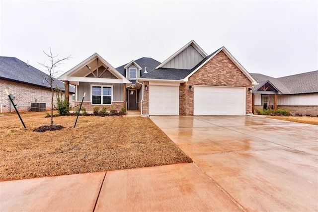 craftsman-style house with central AC and a garage