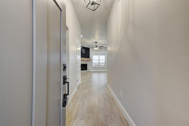 hall with light hardwood / wood-style floors