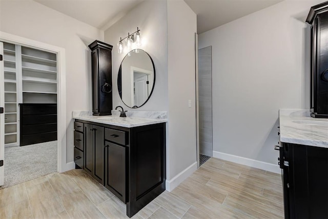 bathroom with vanity and wood-type flooring