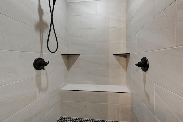 bathroom with a tile shower