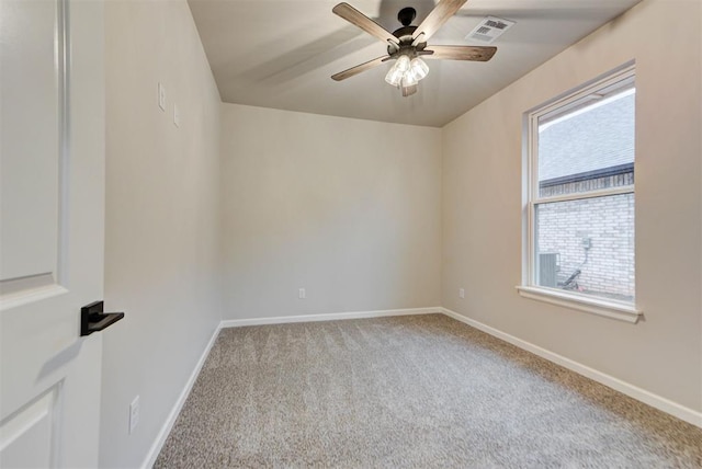 empty room featuring light carpet and ceiling fan