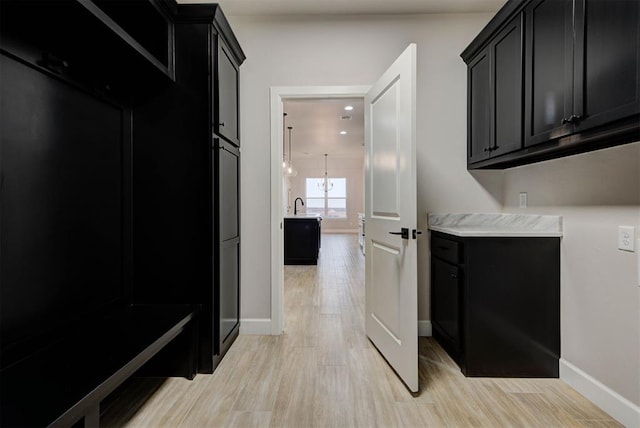 interior space featuring sink and light hardwood / wood-style floors