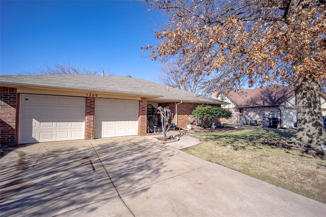 single story home with a garage and a front lawn