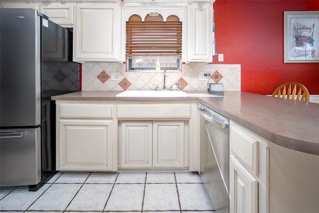 kitchen featuring sink, white cabinets, and appliances with stainless steel finishes