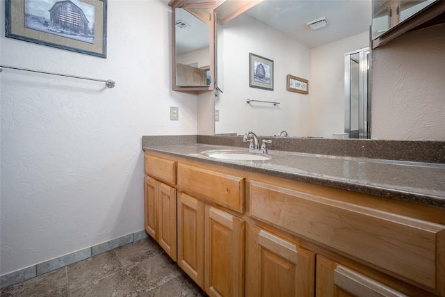 bathroom featuring vanity and walk in shower