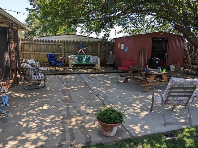 view of patio / terrace with a storage shed