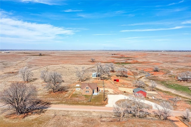 bird's eye view featuring view of desert and a rural view