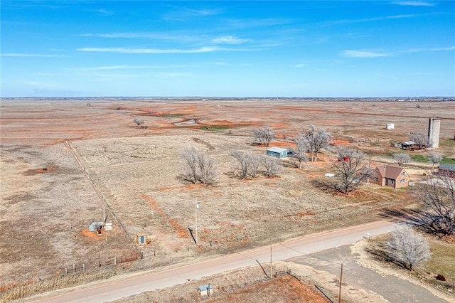 aerial view featuring a desert view and a rural view