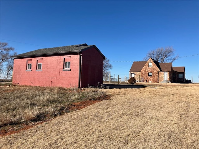 view of side of property with concrete block siding