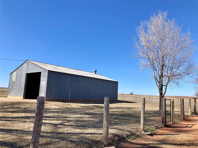 view of pole building featuring fence