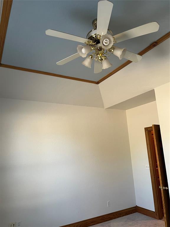 carpeted empty room with ceiling fan