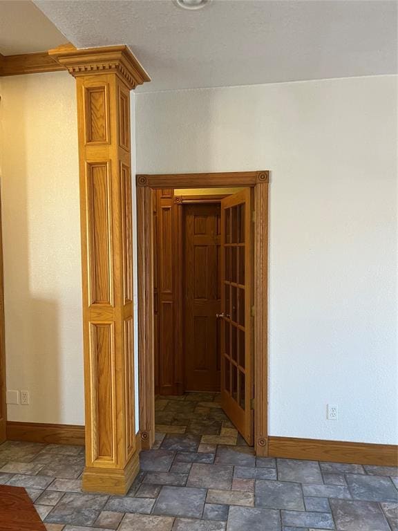 hall featuring ornate columns