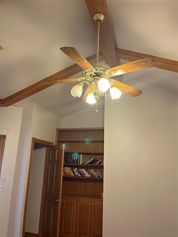 details with ceiling fan and beamed ceiling