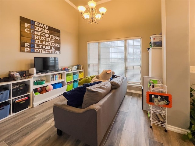3629 W County Street 2850th St, Ninnekah, OK 73067 - recreation room with baseboards, a high ceiling, a chandelier, crown molding, and wood finished floors