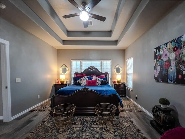 3629 W County Street 2850th St, Ninnekah, OK 73067 - bedroom featuring a tray ceiling, wood finished floors, baseboards, and visible vents