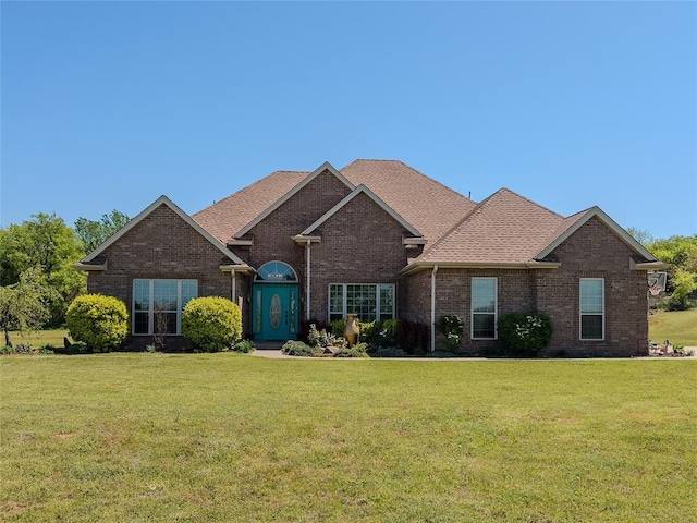 3629 W County Street 2850th St, Ninnekah, OK 73067 - ranch-style house with brick siding, a front lawn, and roof with shingles
