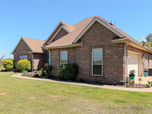 3629 W County Street 2850th St, Ninnekah, OK 73067 - ranch-style house with a front yard, an attached garage, brick siding, and roof with shingles