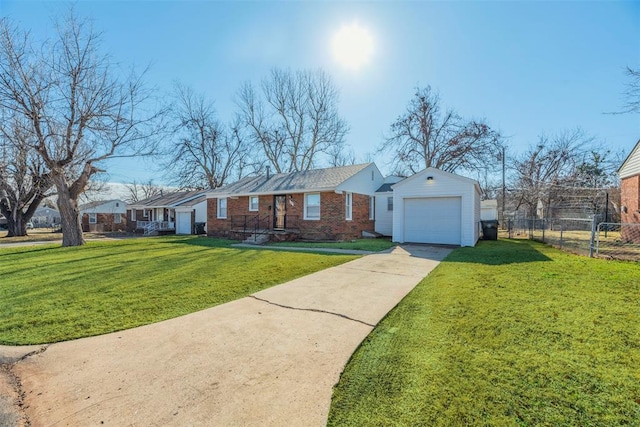 ranch-style house featuring a garage, an outdoor structure, and a front lawn