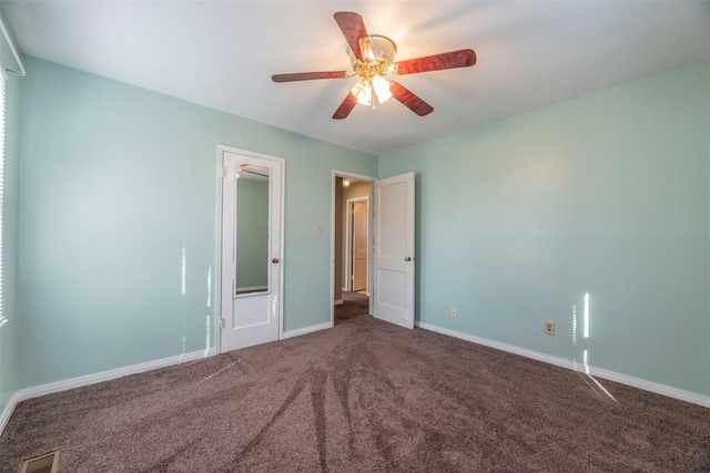 unfurnished bedroom featuring ceiling fan and carpet flooring