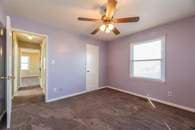 carpeted empty room with ceiling fan