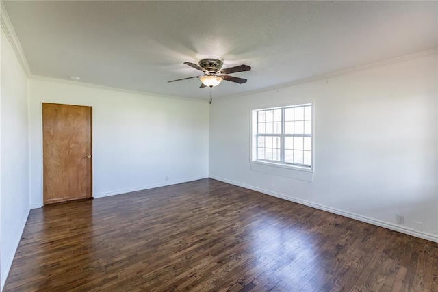 spare room with crown molding, ceiling fan, and dark hardwood / wood-style flooring