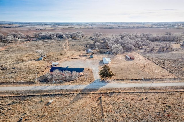 birds eye view of property with a rural view