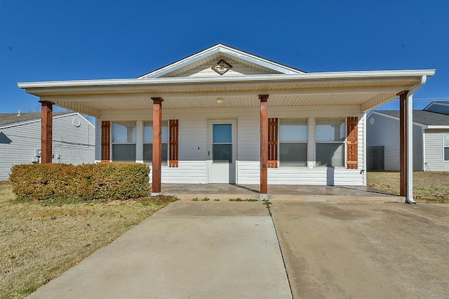 view of front of home with a front lawn and a porch