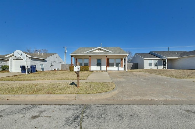 view of front facade featuring a garage, covered porch, and a front yard