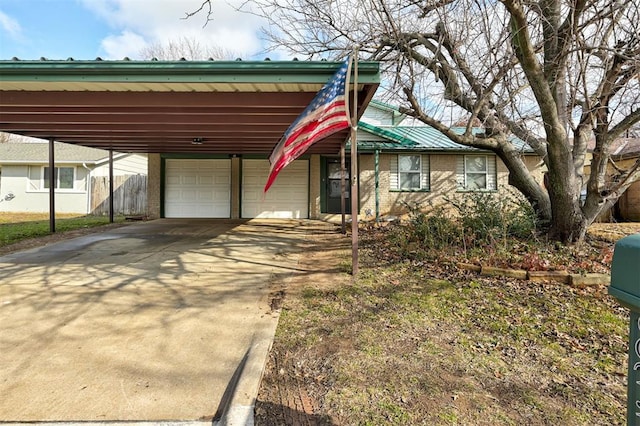 view of front facade with a garage and a carport